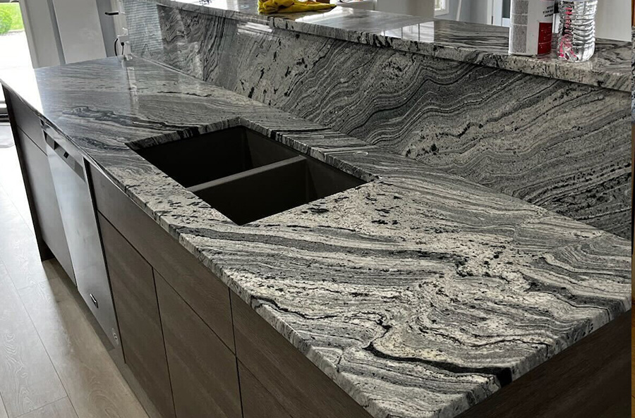 A Recently Completed Grey Kitchen Countertop Paired With A Dramatic Movement And Texture Adds More Value To The Kitchen