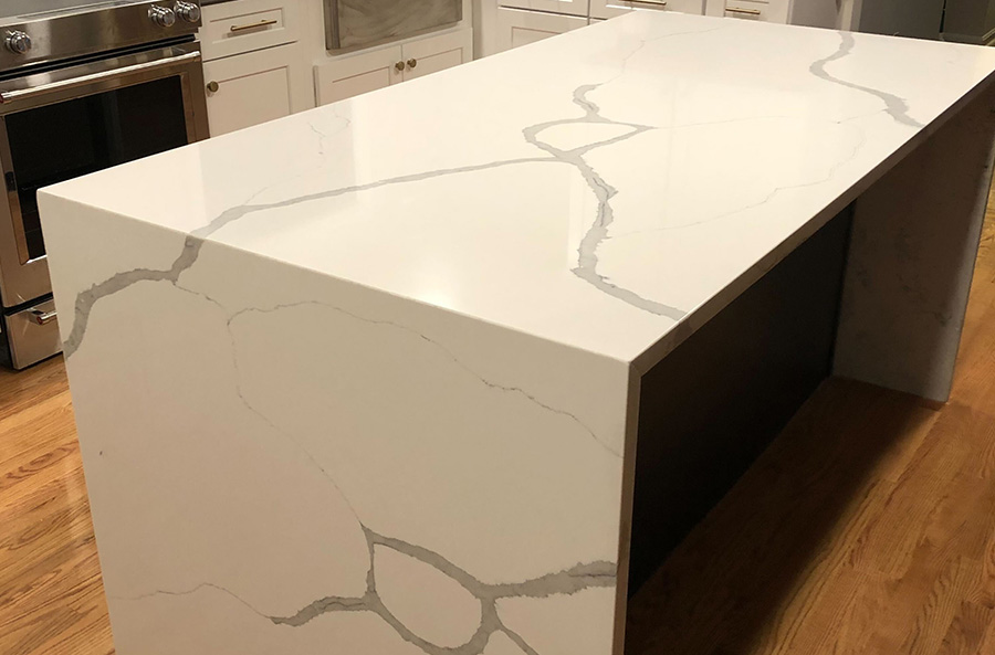 Recently Installed Creamy White Quartz Countertop Island That Has A Waterfall Edge That Is Sure To Outlast Any Trend